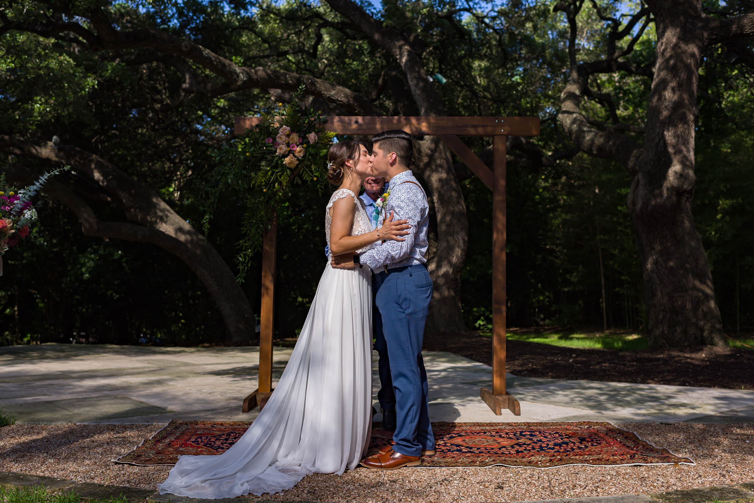 Austin-Wedding-Photographers-texas-ceremony-rug-persian-kiss