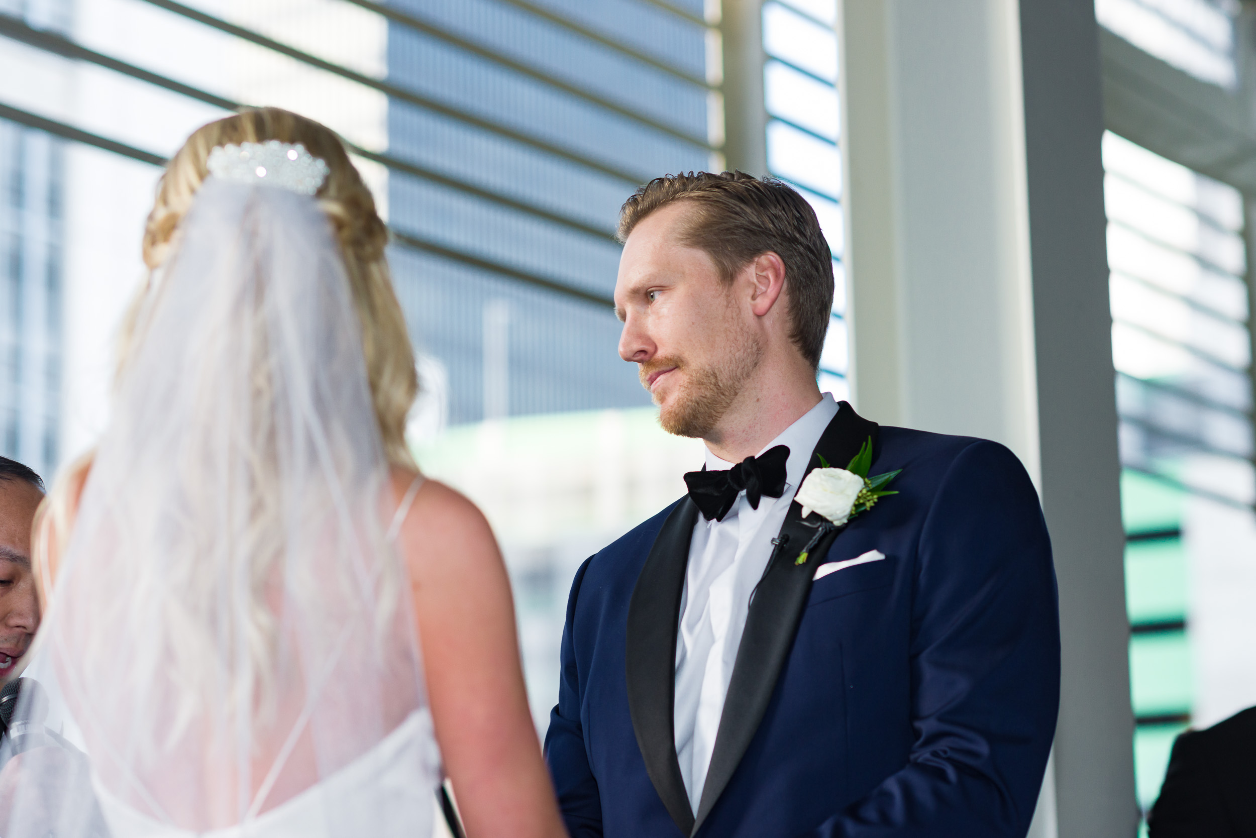 Austin-wedding-photographers-brazos-hall-downtown-ceremony-rooftop-deck-groom-tuxedo-blue