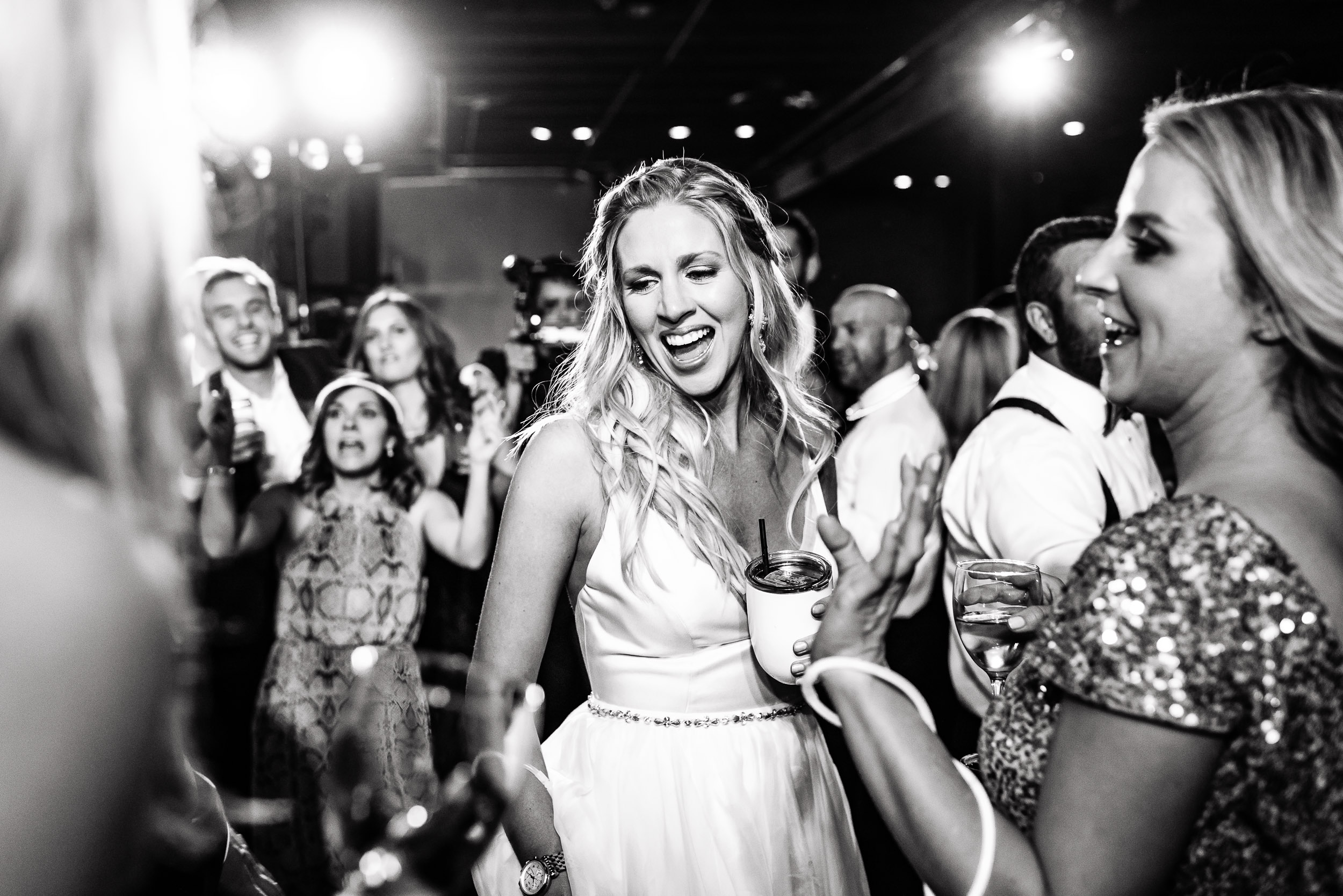 Austin-wedding-photographers-brazos-hall-downtown-reception-dancing-bride-yeti-bridesmaid