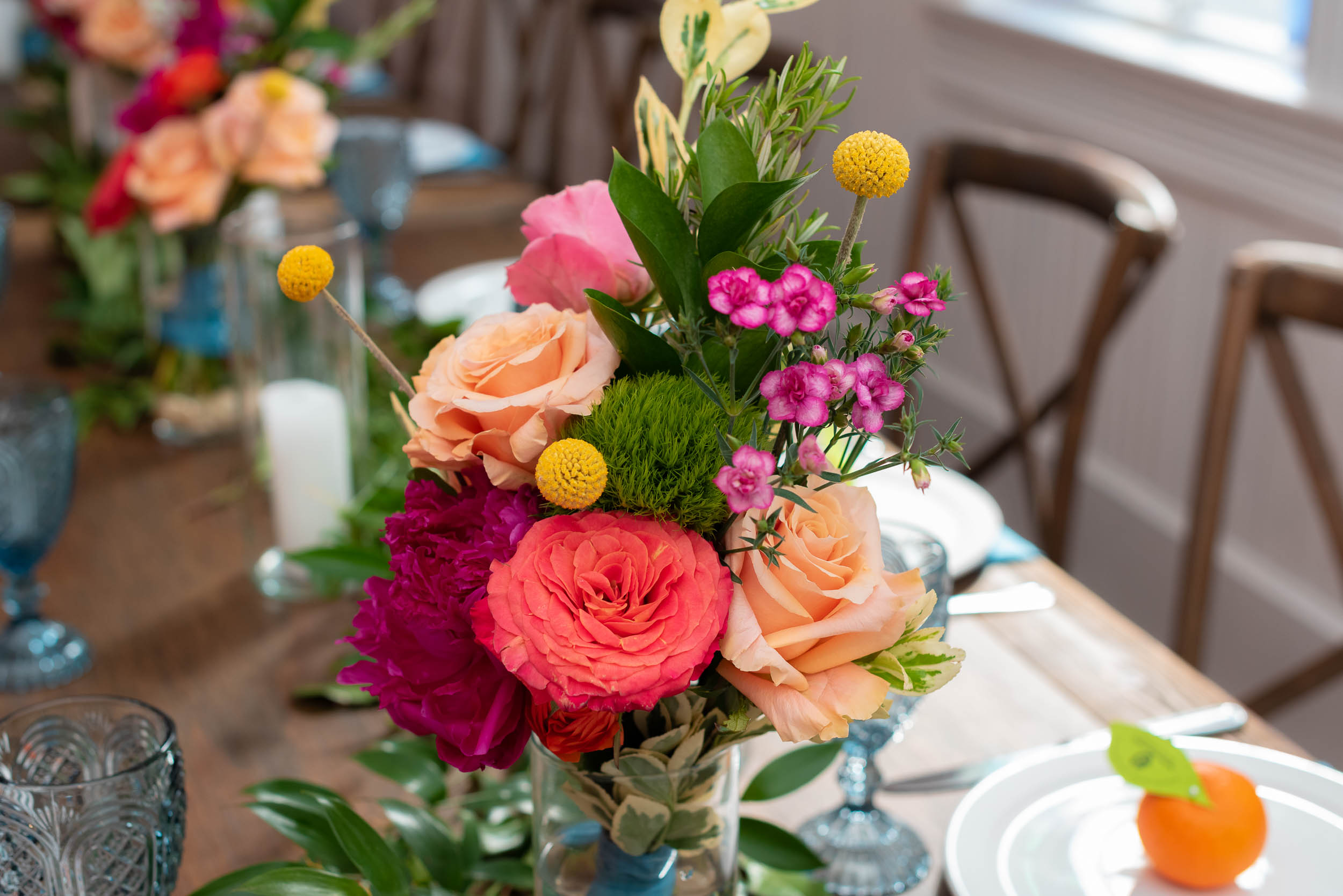 Mercury-Hall-Austin-Wedding-Photographers-texas-oranges-flowers-table-pink-yellow-blue